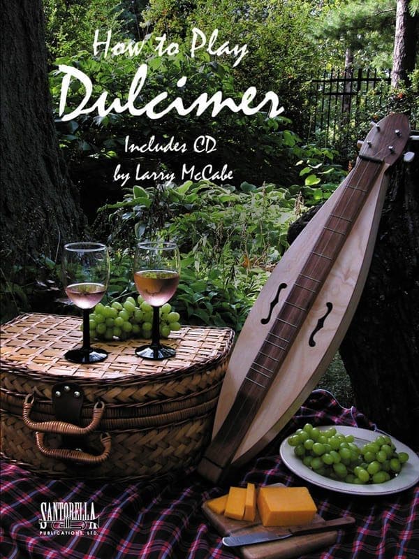 A book cover with an instrument and grapes.