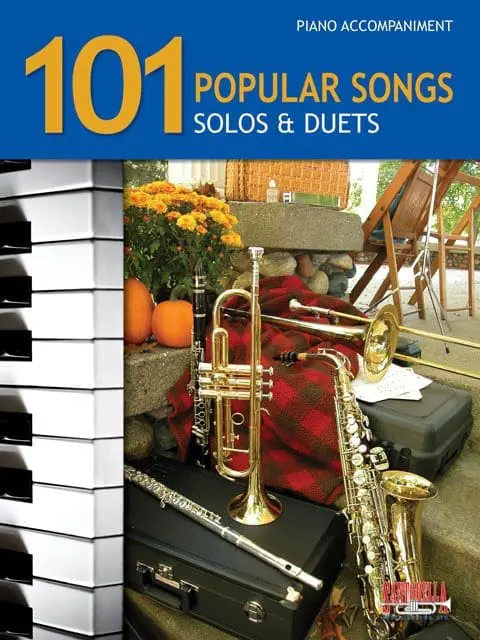 A book cover with piano keys and musical instruments.