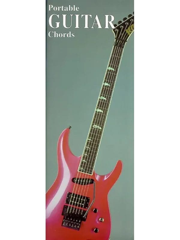 A pink guitar is sitting on top of the cover.