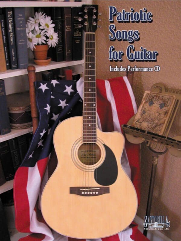 A guitar sitting on top of an american flag.