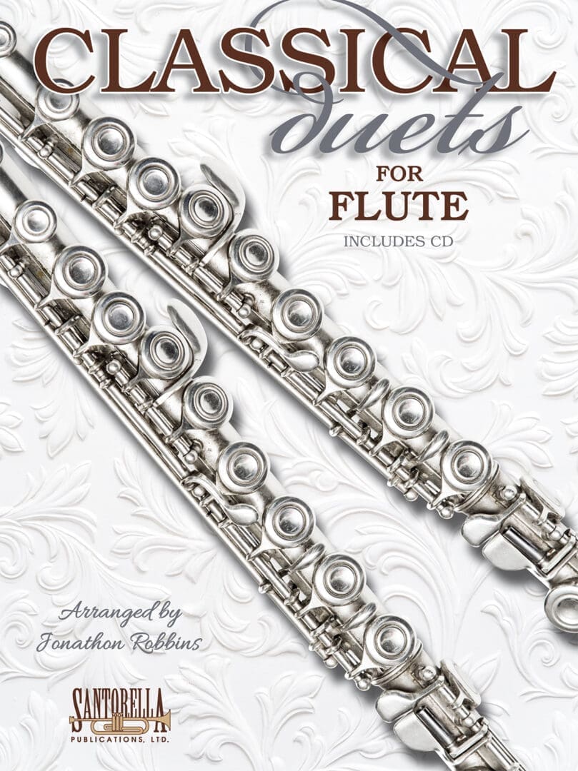 A close up of two silver flute books